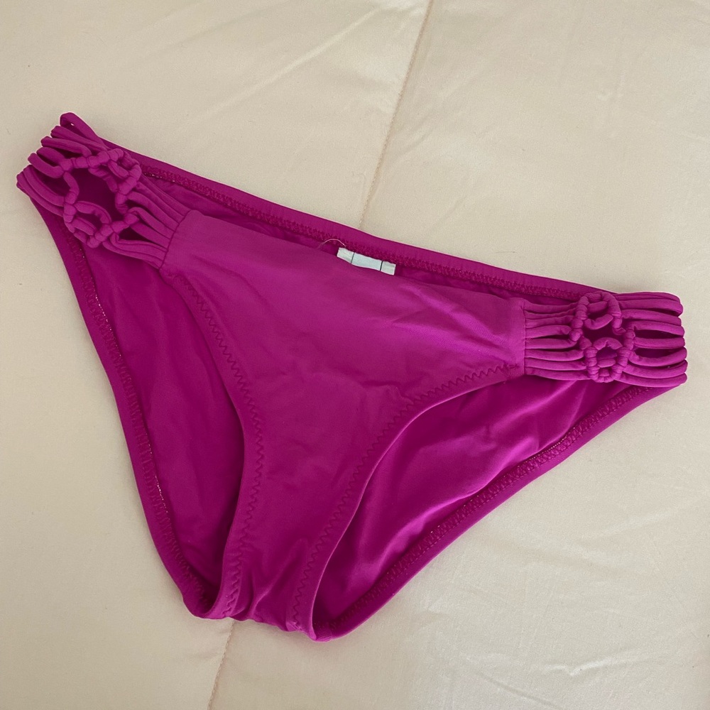 Becca magenta bikini bottoms with cut out